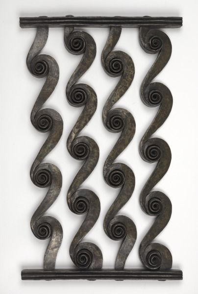 Wrought iron panel with a repeating spiral scroll pattern