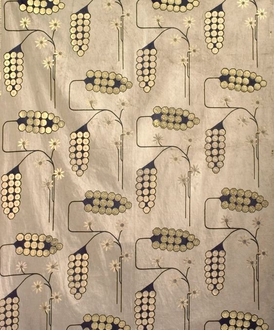 Gold sequin fabric with an embroidered floral vine pattern