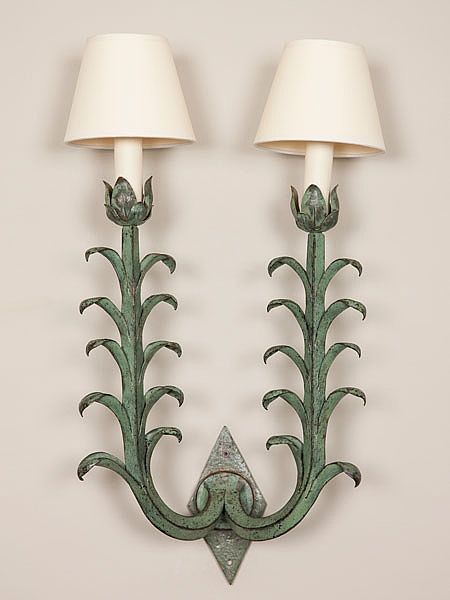 Wrought iron two-arm wall sconce with a verdigris tulip motif